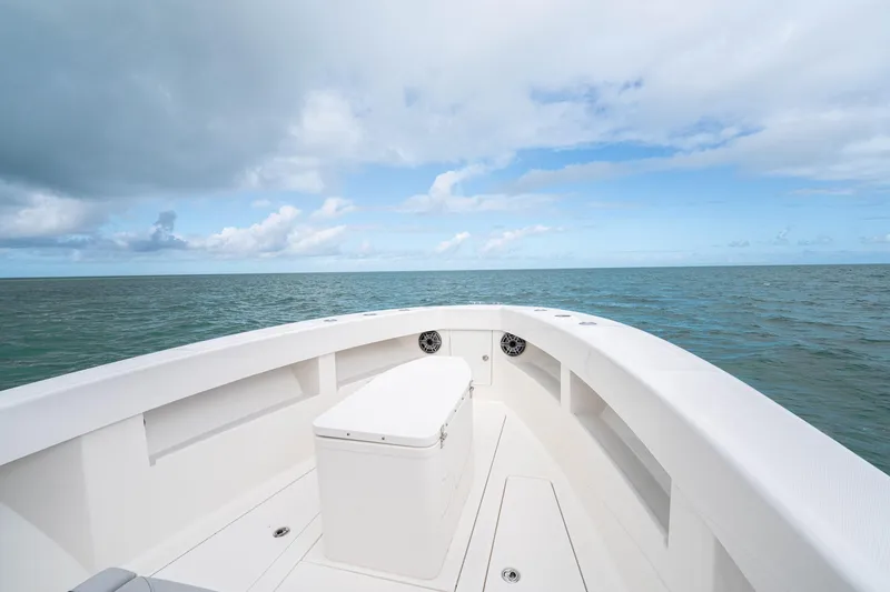 Slide: The Image of Bow view of SeeVee 32 boat, 2099 model, on open sea under cloudy sky. - 18