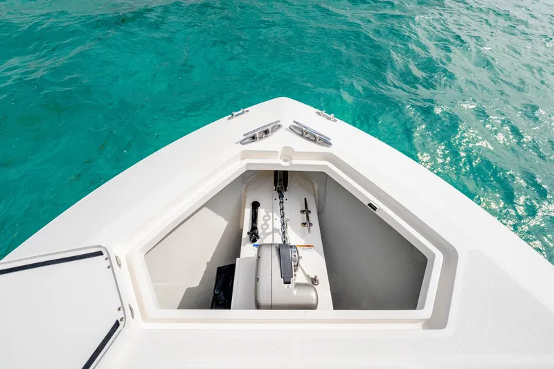 Slide: The Image of Bow of SeeVee 32 boat, 2099 model, with anchor compartment, on turquoise water. - 22