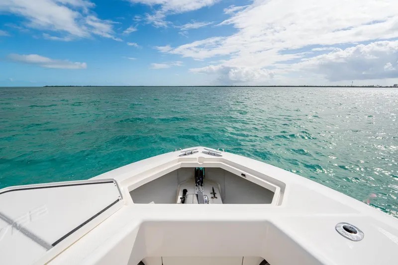 Slide: The Image of Bow view of SeeVee 32 boat on turquoise ocean under blue sky, year 2099. - 23