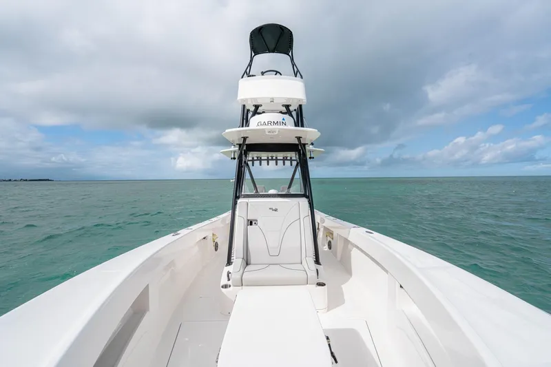 Slide: The Image of SeeVee 32 boat on open sea, 2099 model, with clear skies and calm waters. - 24