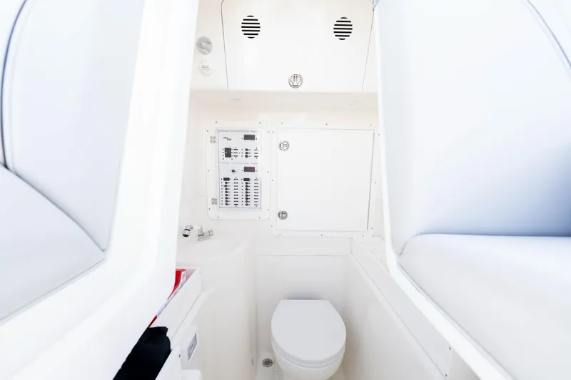Slide: The Image of Interior of SeeVee 32 boat, featuring a compact bathroom with modern fixtures, 2099 model. - 27