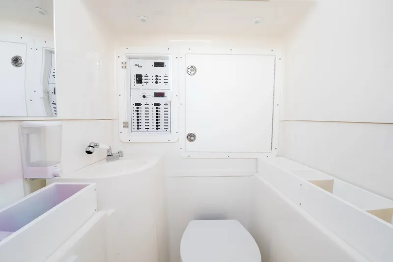 Slide: The Image of Modern SeeVee 32 boat bathroom with control panel, sleek design, and compact layout, year 2099. - 28
