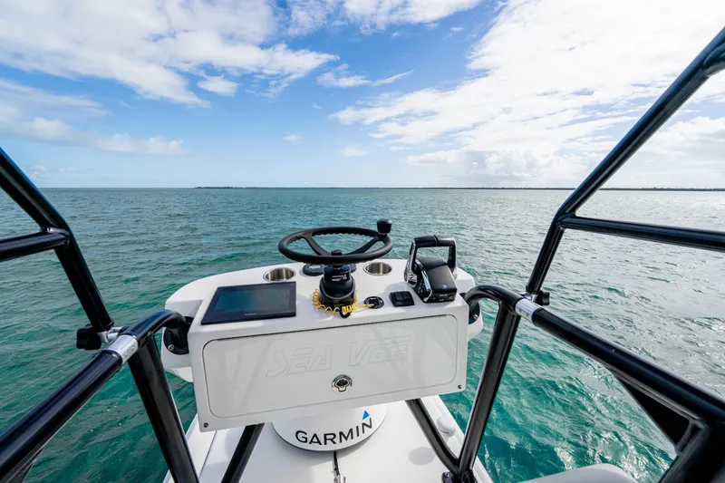 Slide: The Image of Helm of SeeVee 32 boat, 2099 model, with Garmin navigation, on open sea. - 35