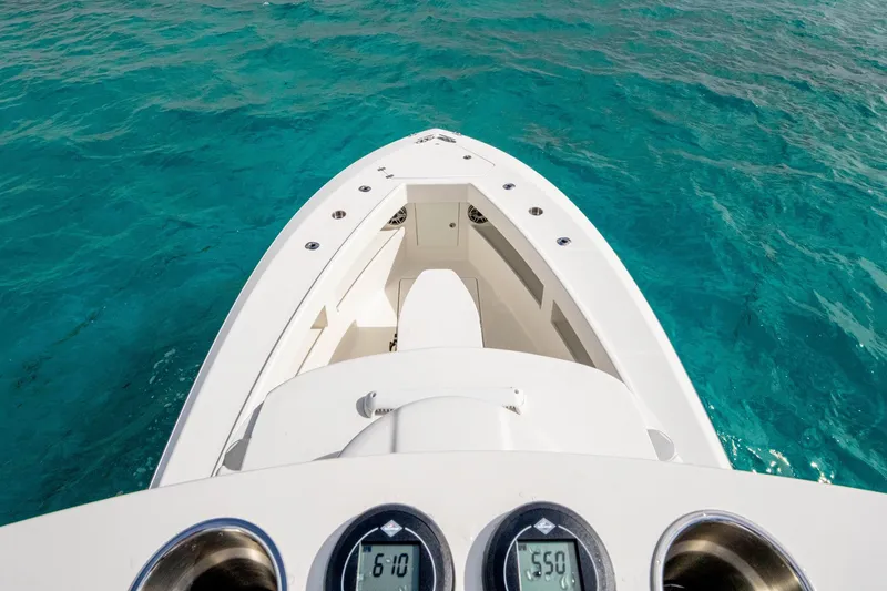 Slide: The Image of Bow view of SeeVee 32 boat, 2099 model, on clear turquoise water. - 37