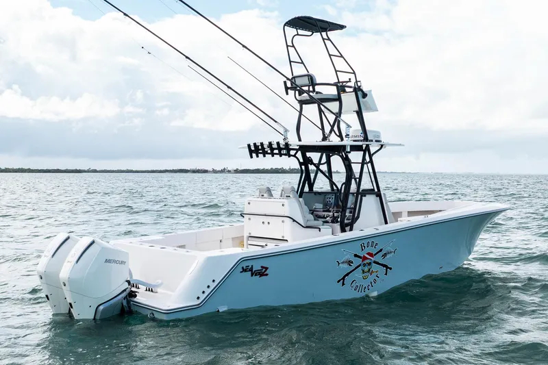 Slide: The Image of Futuristic SeeVee 32 boat on water, featuring dual Mercury engines, 2099 model. - 4