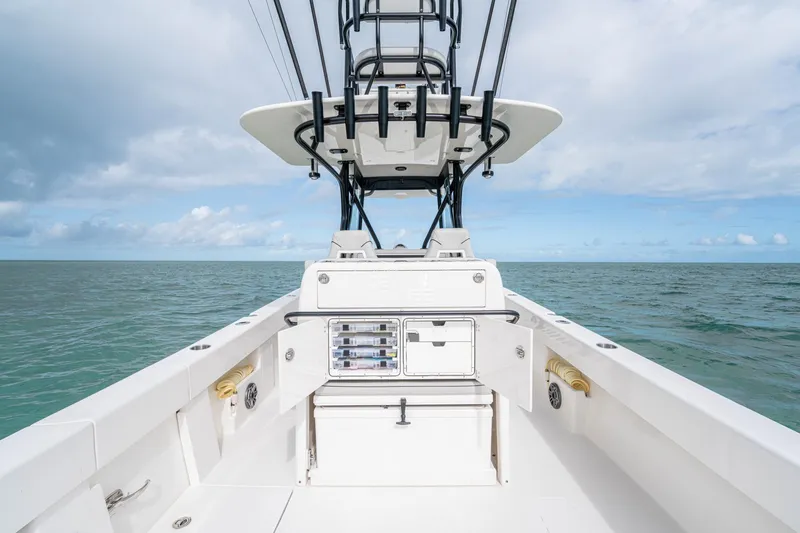 Slide: The Image of SeeVee 32 boat, 2099 model, on open sea under cloudy sky. - 42