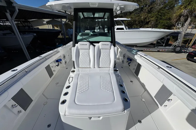 Slide: The Image of 2026 Caymas 34 CT boat interior with white seating and modern design. - 17