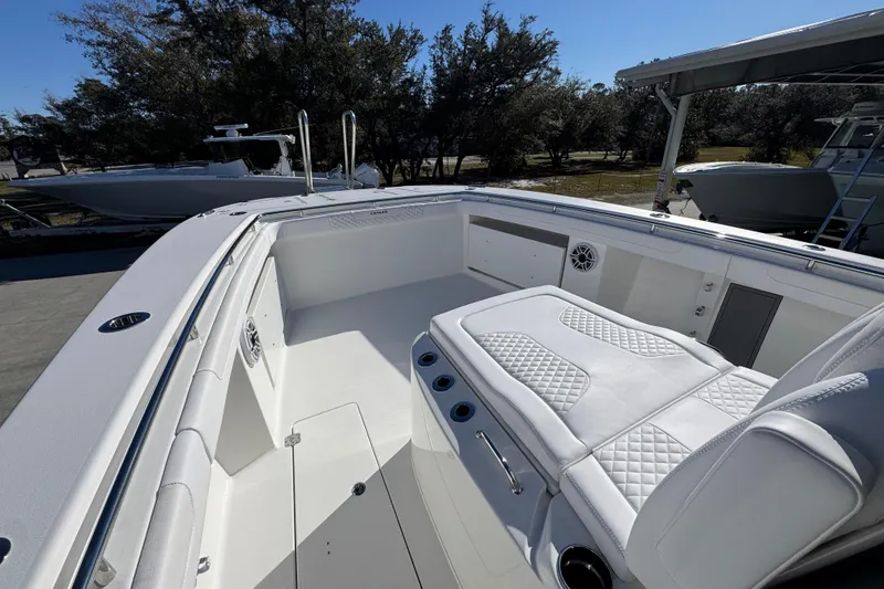 Slide: The Image of 2026 Caymas 34 CT boat interior with white seating and modern design. - 18