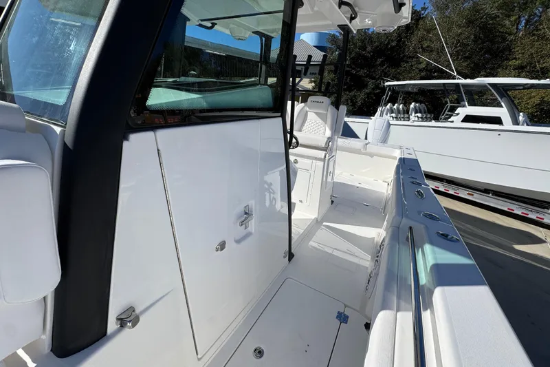 Slide: The Image of 2026 Caymas 34 CT boat interior with sleek white design and modern features. - 21