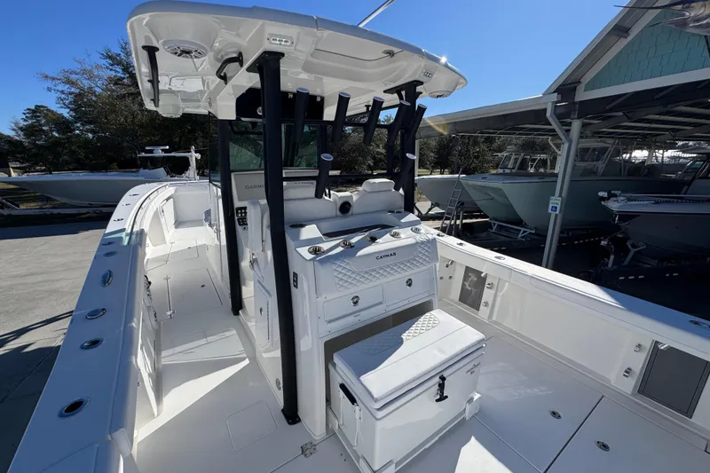 Slide: The Image of 2026 Caymas 34 CT boat interior with helm station and seating. - 33