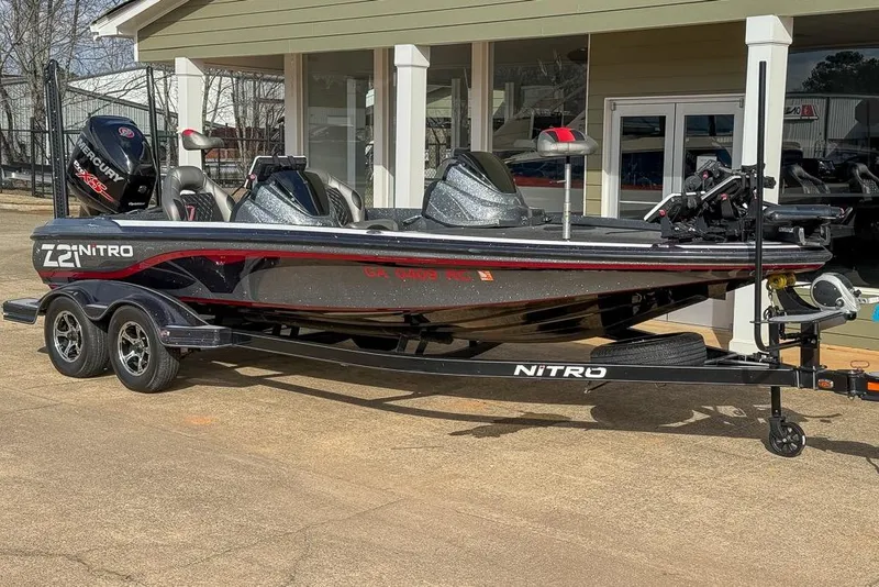 The Image of 2016 Nitro Z21 Pro boat with trailer, parked outside a building. - 0
