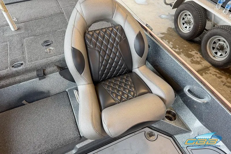 Slide: The Image of 2016 Nitro Z21 Pro boat seat with diamond-pattern upholstery and cup holder. - 14