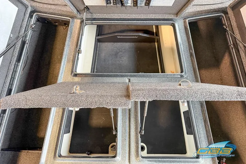 Slide: The Image of 2016 Nitro Z21 Pro boat storage compartments with open hatches, showcasing interior layout. - 18