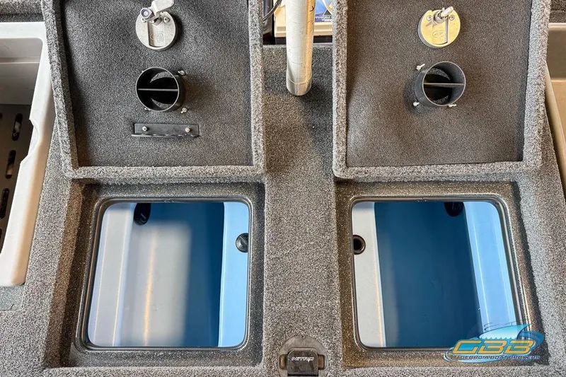 Slide: The Image of 2016 Nitro Z21 Pro boat storage compartments with open lids and ventilation. - 22