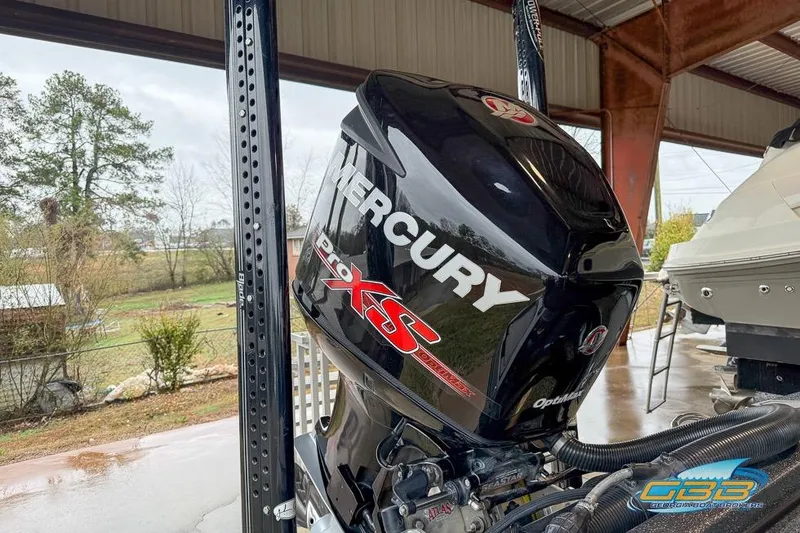 Slide: The Image of 2016 Nitro Z21 Pro with Mercury Pro XS outboard motor in a covered area. - 31