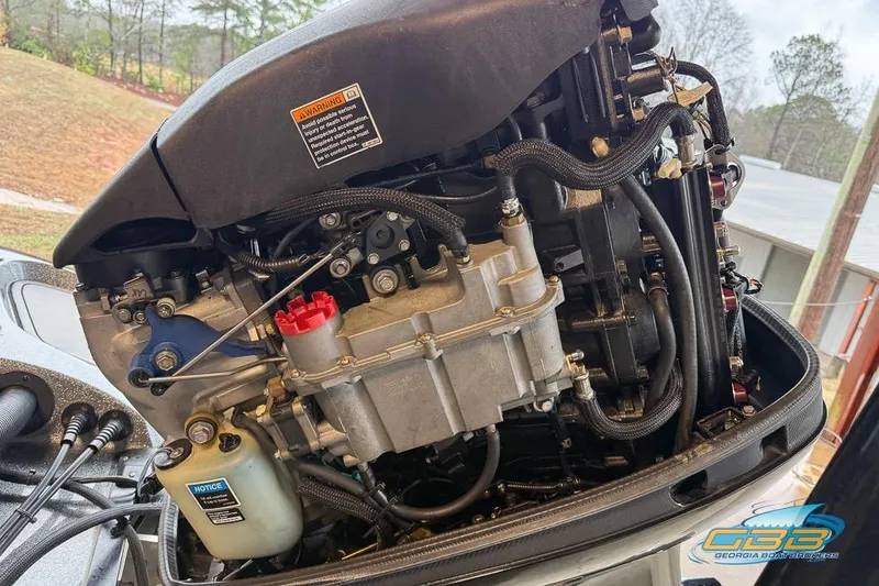 Slide: The Image of 2016 Nitro Z21 Pro engine close-up with visible components and hoses. - 32