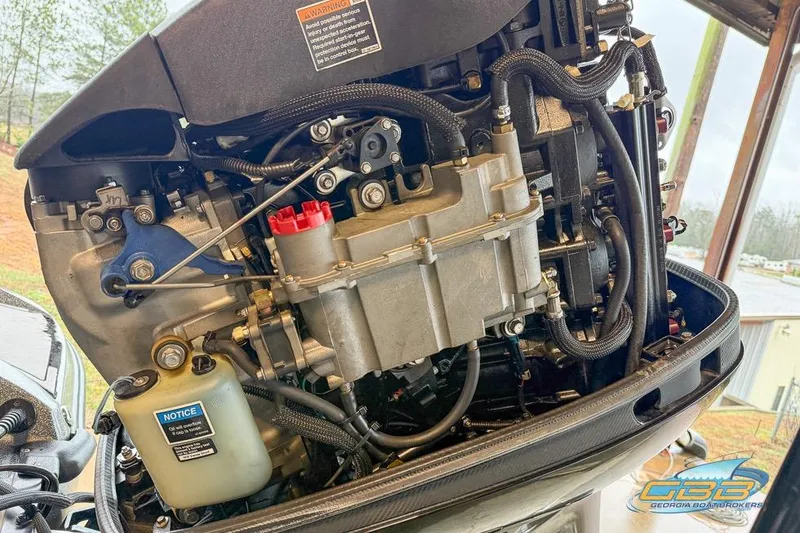 Slide: The Image of Close-up of a 2016 Nitro Z21 Pro boat engine, showcasing intricate mechanical components. - 33