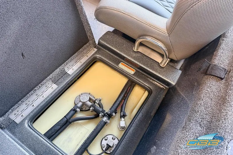 Slide: The Image of 2016 Nitro Z21 Pro boat storage compartment with visible wiring and seat detail. - 40