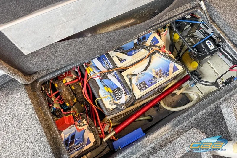 Slide: The Image of 2016 Nitro Z21 Pro boat battery compartment with wiring and components. - 43