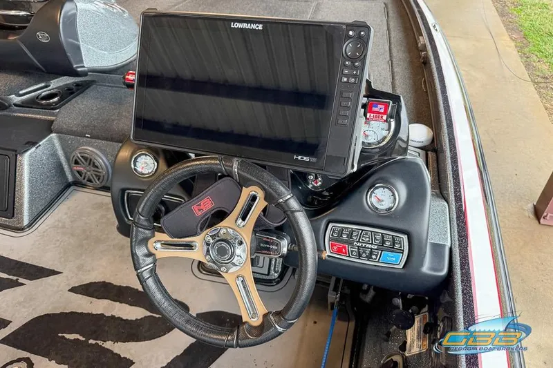Slide: The Image of 2016 Nitro Z21 Pro boat dashboard with Lowrance HDS display and steering wheel. - 9