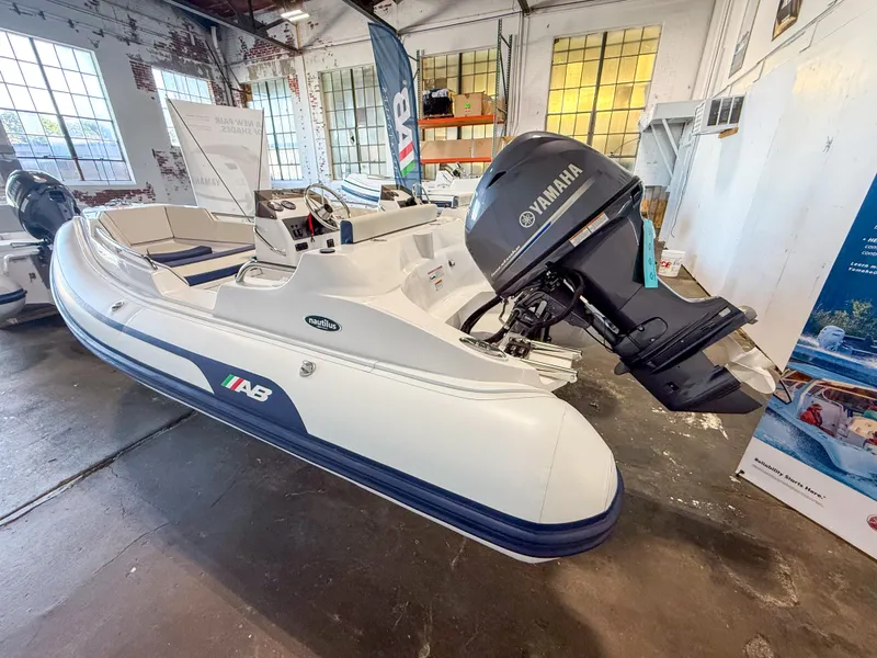 The Image of 2024 AB Inflatables Nautilus 13 DLX boat with Yamaha outboard motor in showroom. - 0
