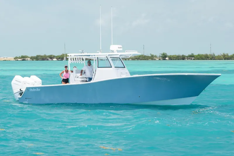 The Image of 2027 Onslow Bay 37 Tournament Edition boat on turquoise water with two people onboard. - 0