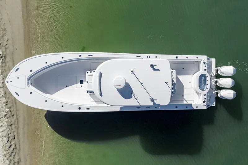 Slide: The Image of Aerial view of 2027 Onslow Bay 37 Tournament Edition boat on clear water. - 2