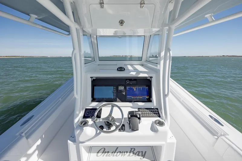 Slide: The Image of 2027 Onslow Bay 37 Tournament Edition boat dashboard on open water. - 3
