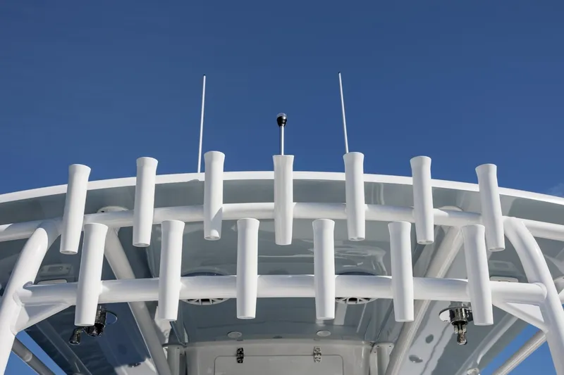 Slide: The Image of 2027 Onslow Bay 37 Tournament Edition boat with rod holders against blue sky. - 5