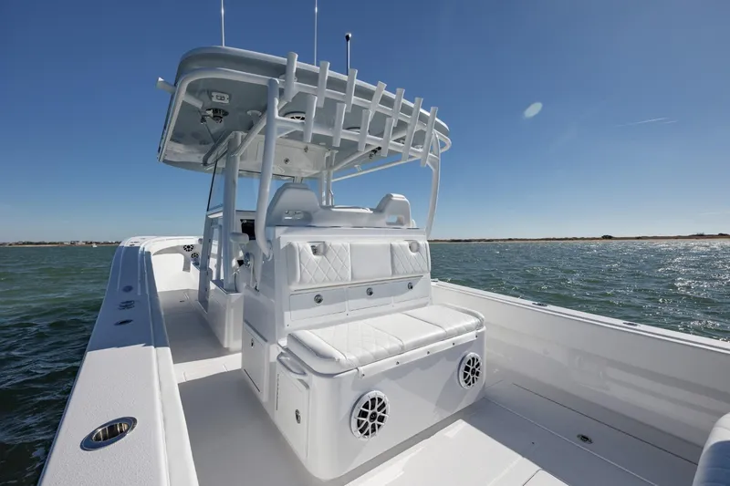 Slide: The Image of 2027 Onslow Bay 37 Tournament Edition boat on open water, featuring sleek white design. - 6