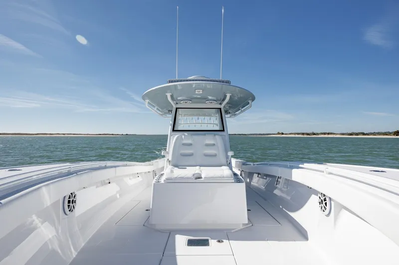 Slide: The Image of 2027 Onslow Bay 37 Tournament Edition boat on open water under clear blue sky. - 7
