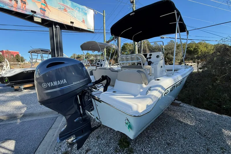 Slide: The Image of 2026 Key West 189 FS boat with Yamaha outboard motor, parked outdoors. - 3