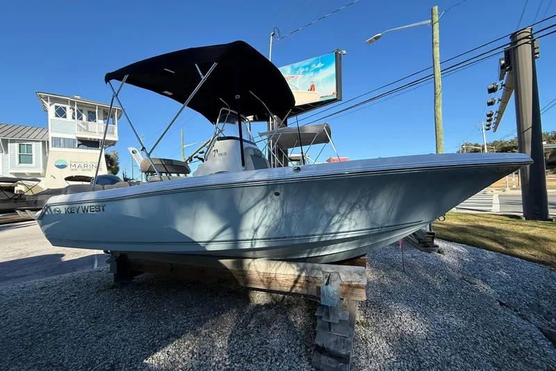 Slide: The Image of 2026 Key West 189 FS boat displayed outdoors on a wooden stand. - 4