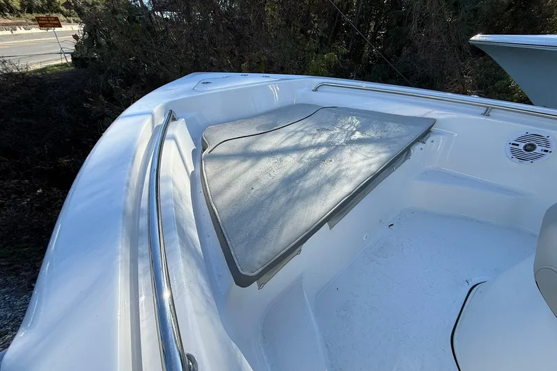 Slide: The Image of 2026 Key West 189 FS boat interior with cushioned seating and stainless steel railing. - 5