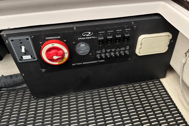 Slide: The Image of Battery management panel of 2014 Regal 28 Express boat with control switches. - 23