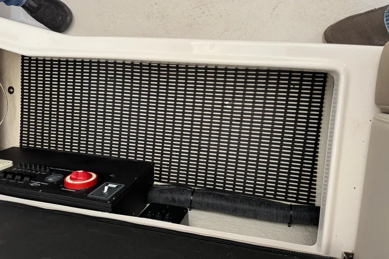 Slide: The Image of Control panel of a 2014 Regal 28 Express boat with safety features. - 24