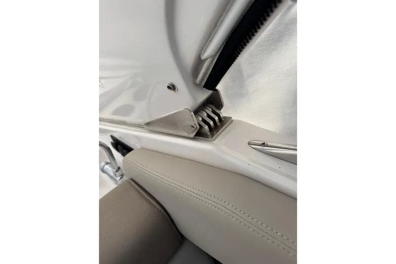 Slide: The Image of Close-up of 2014 Regal 28 Express boat interior detail, featuring seat and metal fittings. - 26