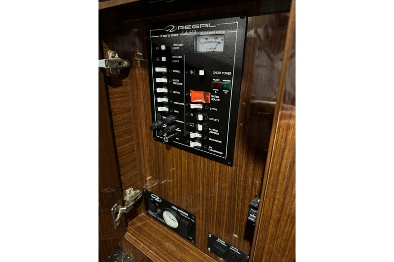 Slide: The Image of Control panel of a 2014 Regal 28 Express boat, featuring various switches and indicators. - 31