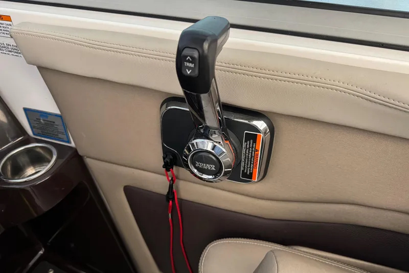 Slide: The Image of Throttle control of a 2014 Regal 28 Express boat with Volvo Penta branding. - 32