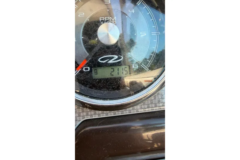 Slide: The Image of Close-up of 2014 Regal 28 Express tachometer displaying 2115 RPM. - 8