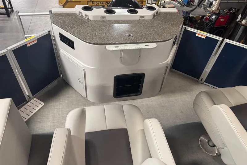 Slide: The Image of Interior of 2021 Godfrey Sweetwater 2386 FS boat with seating and control panel. - 16