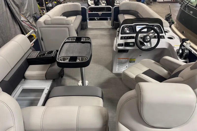 Slide: The Image of Interior of a 2021 Godfrey Sweetwater 2386 FS pontoon boat with plush seating and control console. - 20