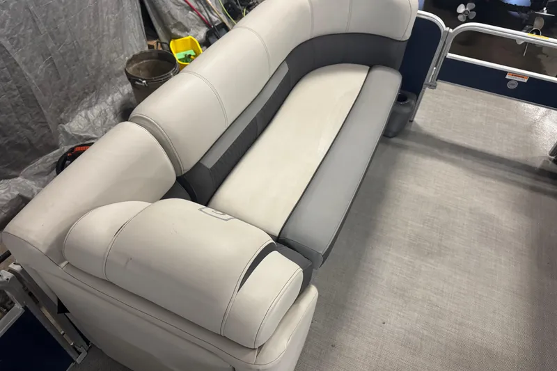 Slide: The Image of 2021 Godfrey Sweetwater 2386 FS boat interior with gray and white seating. - 6