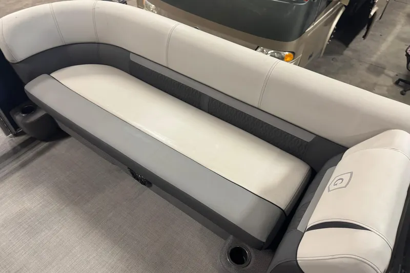 Slide: The Image of 2021 Godfrey Sweetwater 2386 FS boat interior with gray and white seating. - 7