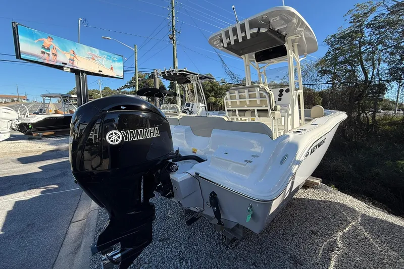 Slide: The Image of 2026 Key West 219 FS boat with Yamaha engine, displayed outdoors. - 3