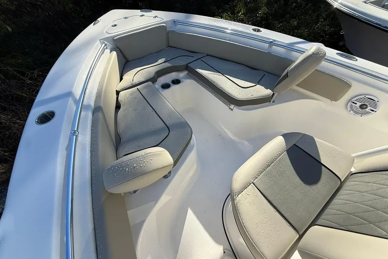 Slide: The Image of 2026 Key West 219 FS boat interior with cushioned seating and cup holders. - 4