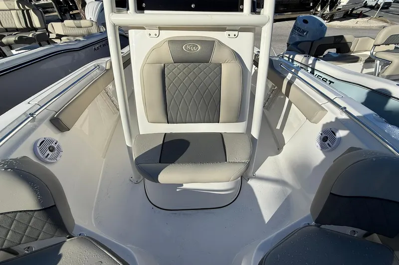 Slide: The Image of 2026 Key West 219 FS boat interior with gray seating and modern design. - 5