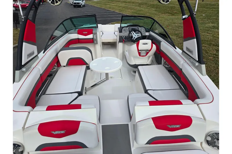 Slide: The Image of 2015 Chaparral Vortex 223 VRX boat interior with red and white seating. - 11