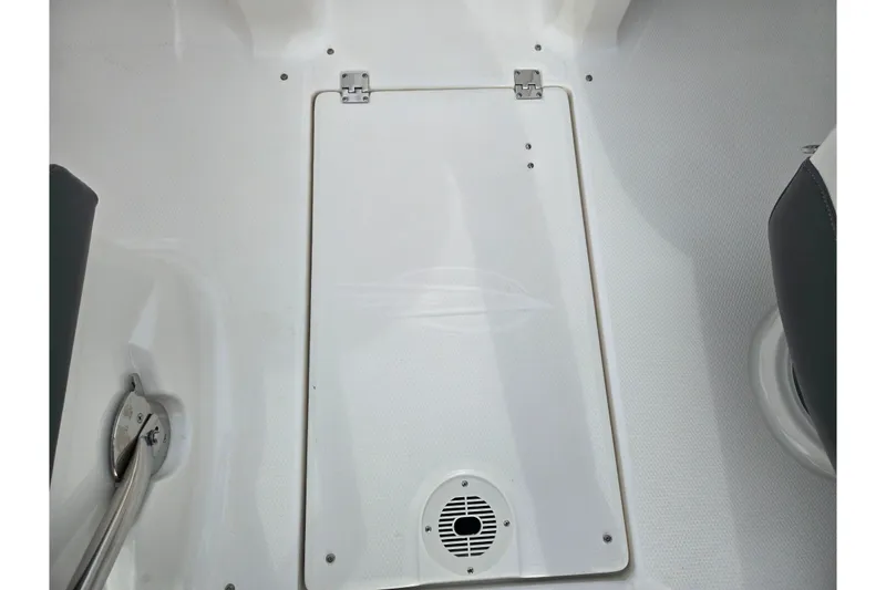 Slide: The Image of 2015 Chaparral Vortex 223 VRX boat interior with storage hatch and speaker. - 13