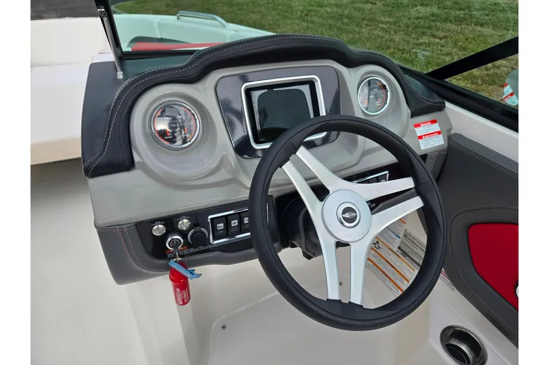 Slide: The Image of 2015 Chaparral Vortex 223 VRX dashboard with steering wheel and gauges. - 15